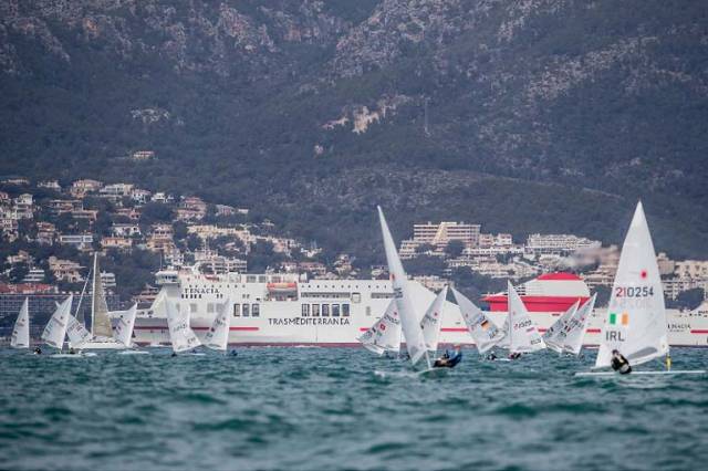 Finn Lynch (right of shot) makes his approach to the weather mark and a fine seventh placing in the first race of Trofeo Princesa Sofia Regatta in Mallorca
