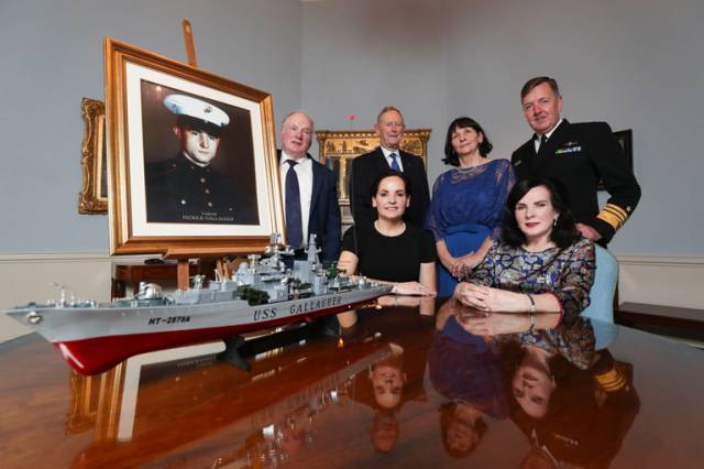 Pictured are siblings of Corporal Patrick ‘Bob’ Gallagher, Peter, Pauline, Theresa and Rosemary  with a portrait of their brother Corporal Patrick Gallagher and replica of USS Gallagher at the reception in recognition of naming of the ship USS Patrick Gallagher hosted by Lord Mayor of Dublin Nial Ring