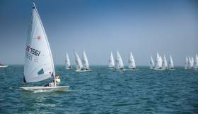 Royal Cork&#039;s Chris Bateman (157561) works the right hand side of the course in the final race of the Laser Radial division of the Volvo Youth Sailing Nationals on Dublin Bay. Royal Cork sailors performed well at the event, scroll down for more.