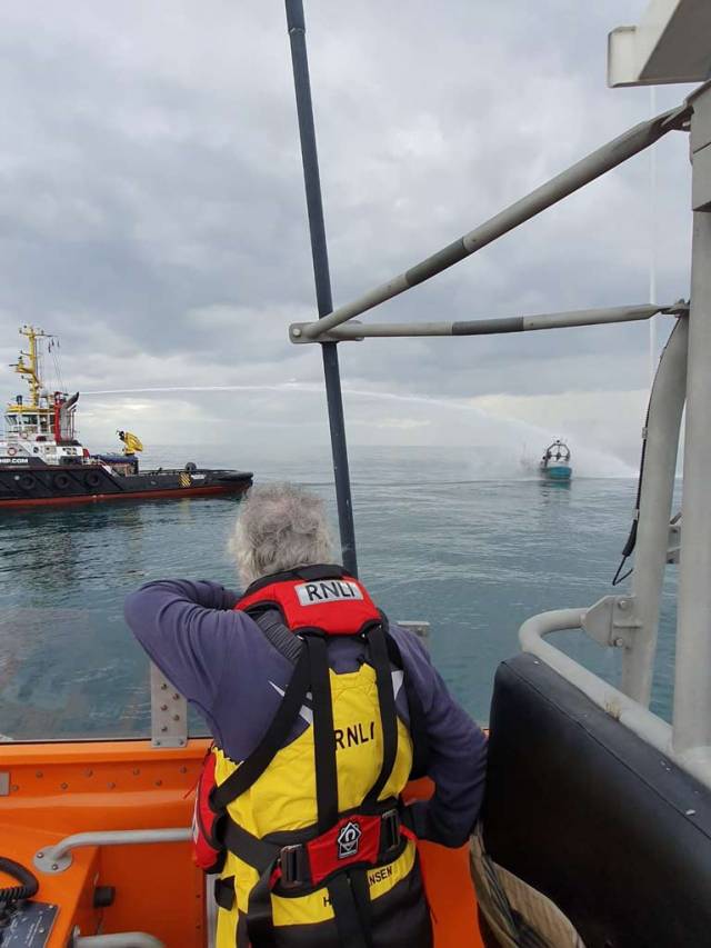 Three fishermen had evacuated on to their life raft and had transferred to a nearby vessel
