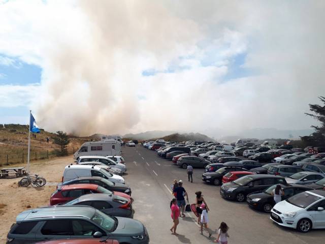 Smoke from the dune fire blows over the car park at Curracloe beach this afternoon