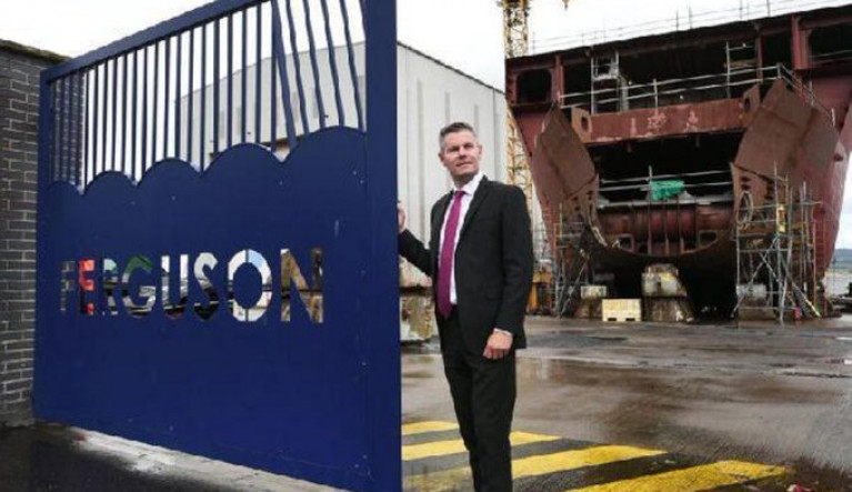 File photo: Derek Mackay the (former) Finance Secretary of Scotland AFLOAT adds pictured at the shipyard of Ferguson Marine with one of the newbuild ferry pair under construction for CalMac in Port Glasgow on the Clyde.
