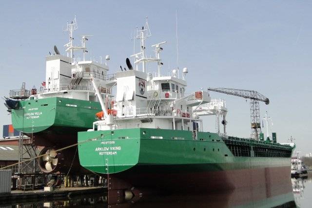 Newbuild sisters Arklow Villa the final of 10 ships for ASN sits high and dry at a Dutch yard's fit-out quay where berthed alongside is Arklow Viking which began sea trails yesterday. 