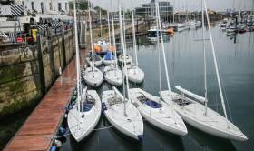 The Irish Dragon fleet moored alongside at the Royal Irish Yacht Club after the first day of the East Coast Championships on Dublin Bay