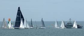 Today&#039;s Round Ireland 2016 start line showing a busy committee boat end. There was a southerly 10–knot breeze with a two knot tide pushing boats over the line