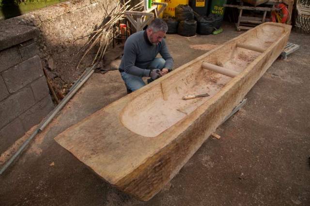 Master craftsman Mark Griffiths working on full scale replica of 2,400 year old logboat found on Connemara's lough Corrib