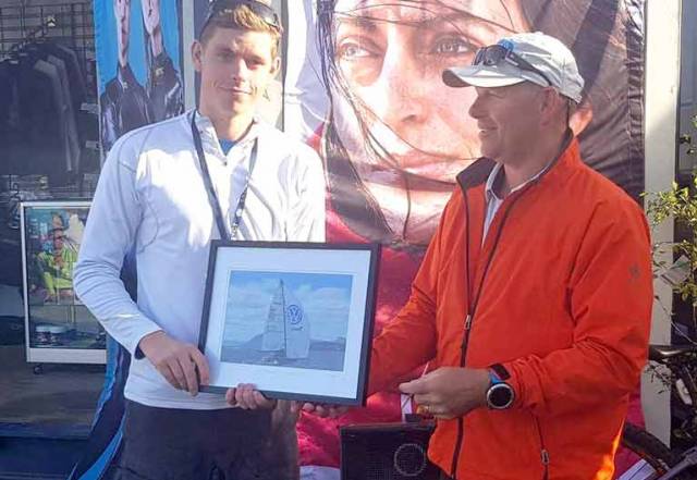 Howth Yacht Club's Cillian Dickson (left) accepts his prize as leading youth boat at the SB20 Worlds in Hobart