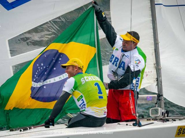 Winners Robert Scheidt and Henry Boening of Brazil celebrate victory on Lake Garda