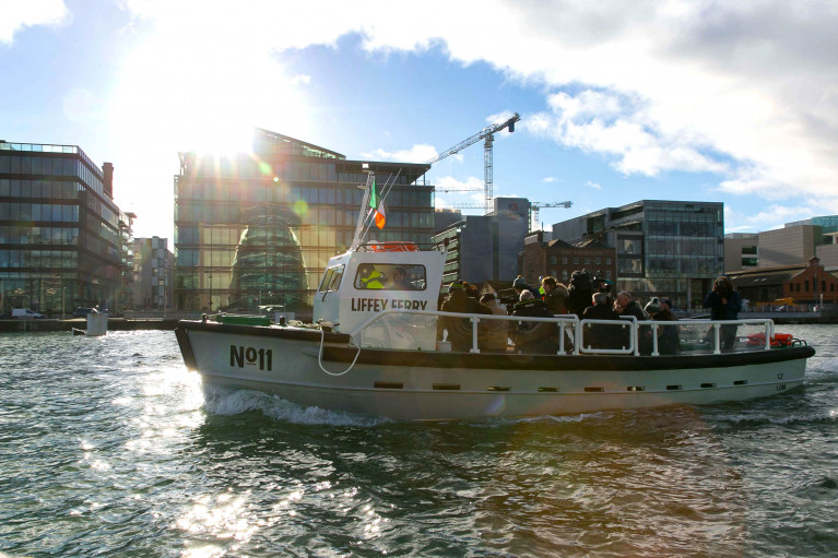 Former Dockers Taxi: The Liffey Ferry is back in service as above underway is the No.11 which is operating to strict social distancing measures during the short crossing linking three pontoon stops located in the centre of Dublin's 'Docklands' quarter. 