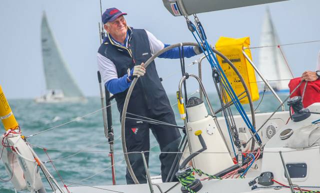 Author Mark Mansfield on the helm of a J109 at the start of the 2016 Round Ireland Race from Wicklow