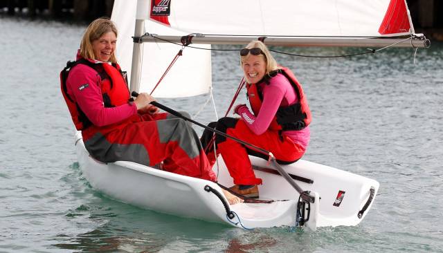 People at every level can get involved with bringing newcomers into the sport. Showing how it’s done with a Toppper Topaz at a Try Sailing Women on Water event is former Olympian Cathy MacAleavey (left) with sailing newbie Sarah Byrne.