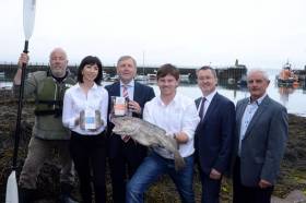Jim Kennedy of Atlantic Sea Kayaks, Monica Buckley and Peter Shanahan of The Fresh Fish Deli in Rosscarbery, Marine Minister Michael Creed, BIM chief Jim O&#039;Toole and Finian O&#039;Sullivan, chair of FLAG South pictured at Ballycotton Harbour at the announcement of a €3.6 million Fisheries Local Area Action Group (FLAG) fund for Ireland’s seven coastal regions