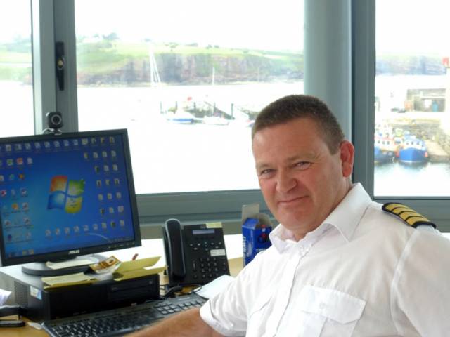 Dunmore East Harbour Master Harry McLoughlin in his control centre atop the new Harbour Services Building, with the busy new Visitors Pontoon beyond