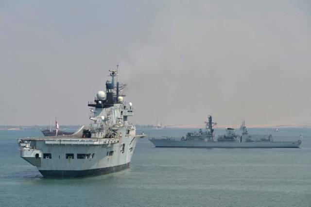 A previous visitor to Dublin Port the former aircraft carrier HMS Invincible which was scrapped last year is seen at anchor in the Suez Canal. Also at anchorage is the Duke Type 23 frigate HMS Westminster which is visiting Dublin this weekend. 