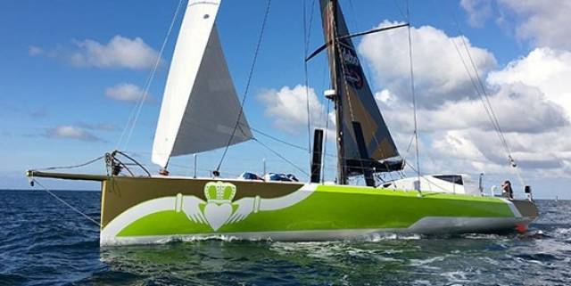 Enda O'Coineen's IMOCA 60 arriving in Kinsale this past August fresh from its refit in France with new race livery