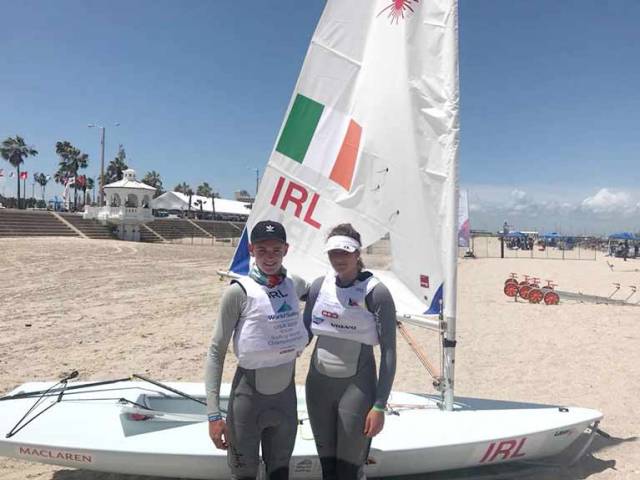 Jack Fahy (left) of Lough Derg and the Royal St. George Yacht Club and Nell Staunton of the National Yacht Club on the beach in Corpus Christi