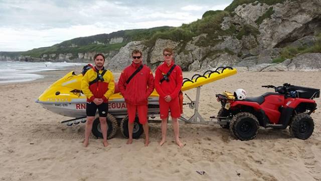L-R RNLI Lifeguards, Bosco McAuley, Ali Boyd and Stephen Parish pictured yesterday in front of the RNLI Rescue Water Craft following the rescue at Whiterocks
