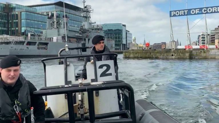 In this mid-April scene was according to the Naval Service the LÉ Eithne (P31) berthed at Albert Quay in Cork city, which is supporting the S/SW Region of the HSE. At the same time the navy continued framework operations and training with the navy deploying RIB boats on patrols of the River Lee. Also above two crew members, Able Seaman Adam Duggan (NSR) and Able Seaman Sean O’Leary were conducting such an exercise.