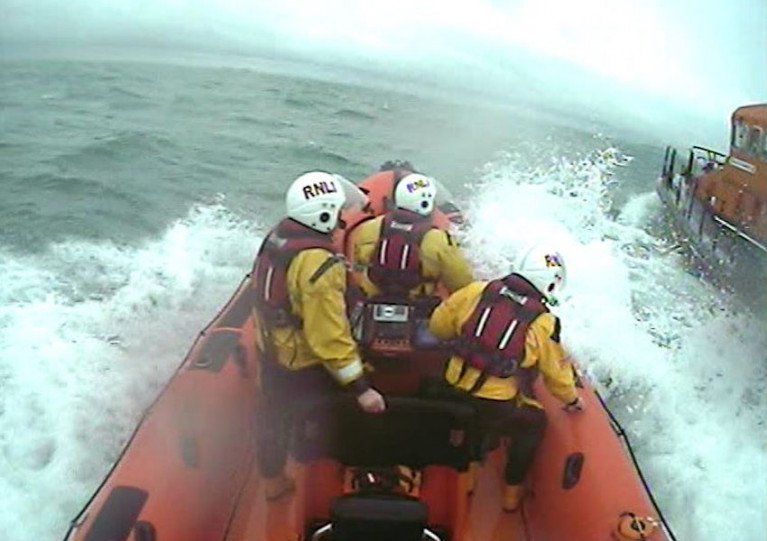 Skerries volunteers in their inshore lifeboat alongside Howth RNLI