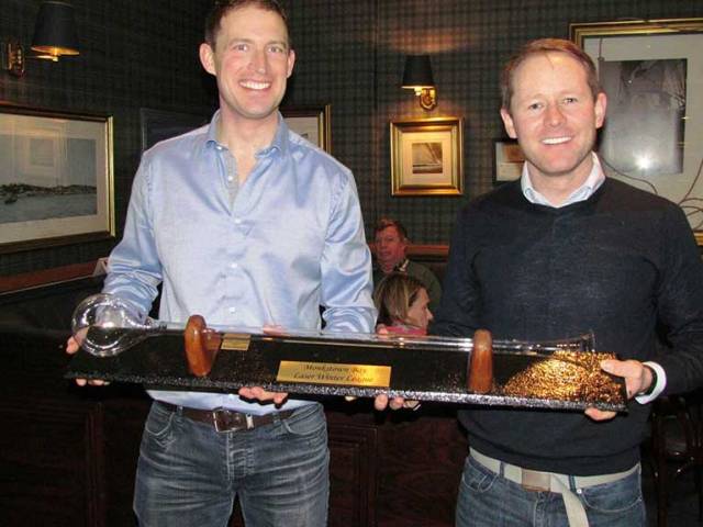 Ronan Kenneally (left) is presented with 'The Yard-of-Ale' Trophy by Charles Dwyer on Winning the Monkstown Bay Sailing Club's Laser Winter League for the second-year in succession