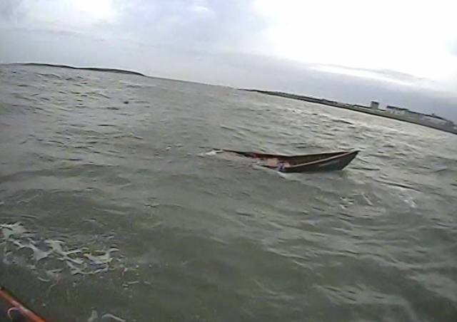 The capsized currach off Skerries