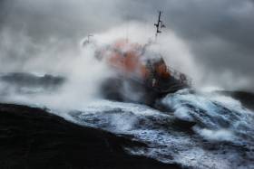 An RNLI Lifeboat operating in stormy seas
