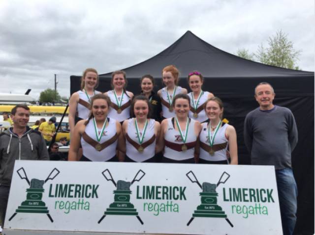 Cork Boat Club, the women's junior 18 eight winners at Limerick Regatta. Included are coaches Stephen Murphy and Terence McGrath. 
