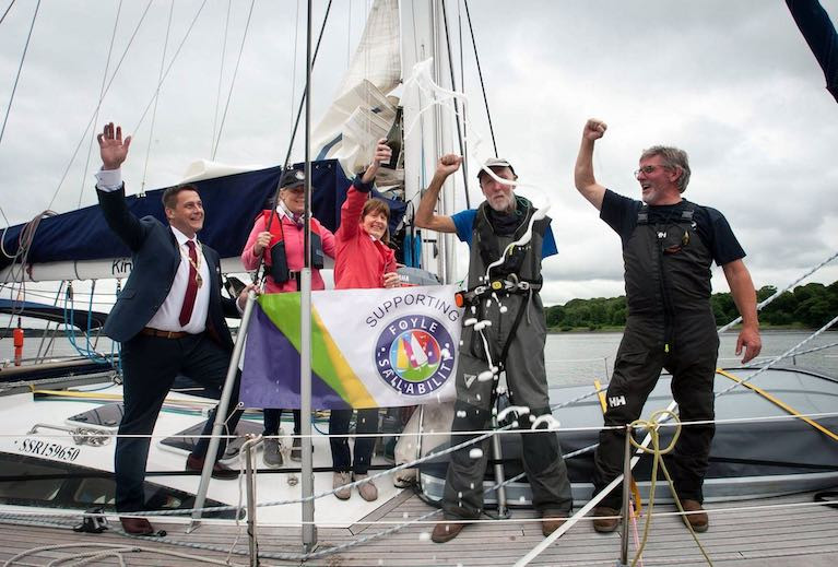 Solo sailor Gary Crothers (second from right) is congratulated on returning home to Derry this summer in his yacht a Kind of Blue