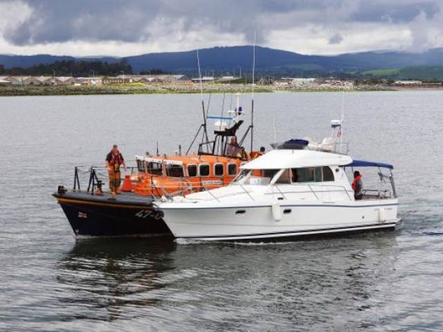 Wicklow RNLI's all-weather lifeboat taking the cruiser under tow