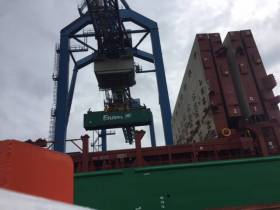 Unloading of containers from a EUCON lo-lo vessel, Elbetrader at the Port of Rotterdam. 