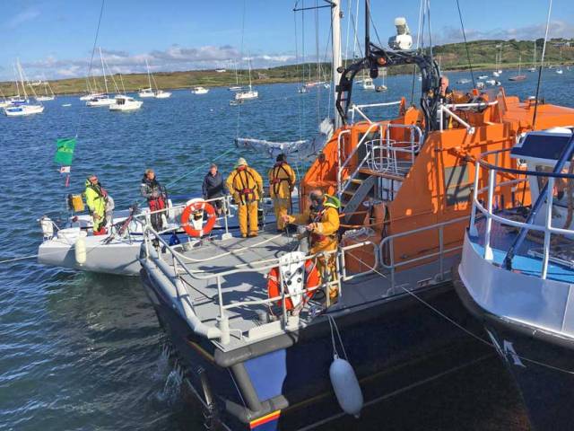Baltimore RNLI safely secures the stricken Fastnet Race yacht in Baltimore Harbour