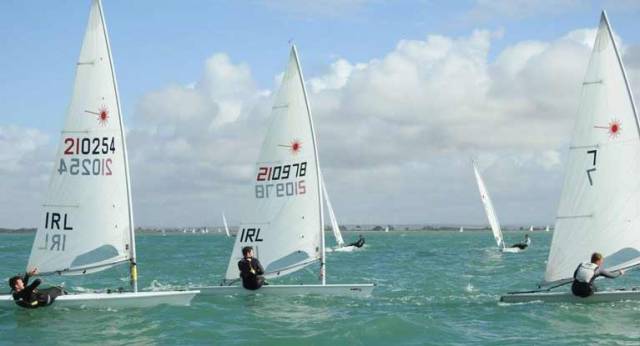 Lynch (IRL 210978) on his way to bronze in the Bay of Cadiz. Ballyholme's Liam Glynn (210254) is to weather as the boats approach a weather mark