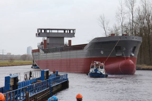 The shell of newbuild Scot Navigator just after launching. The cargoship will have a 5,500 cubic capacity for timber products and is due for delivery in May. 