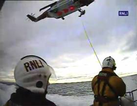 Larne RNLI winching crew from the deck of their all-weather lifeboat to Rescue 999 from Prestwick