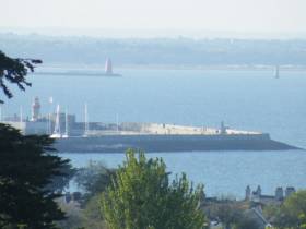 East Pier, Dun Laoghaire Harbour as seen from Dalkey Quarry which was used to begin construction in 1817. Among the events of DLR Spring into Heritage are free guided walking tours of the 200 year old harbour. Beyond are the lighthouses that mark the entrance to Dublin Port.