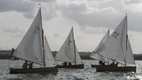 Michael and Jenny Donohoe in Water Wag No.12, Alfa, Paul and Anne Smith in Swallow No.40, and William and Linda Prentice in Tortoise No.42 approaching the start line.