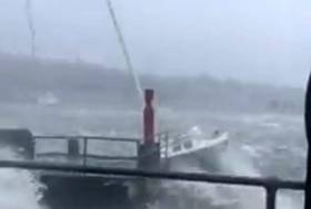 The seemingly doomed yacht narrowly avoids collision with Monkstown&#039;s quay wall then disappears downwind in the spume. Scroll down for video