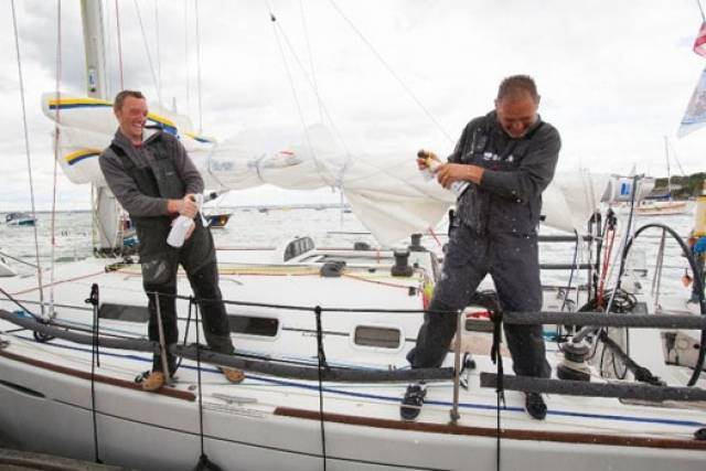 Dubliners Liam Coyne and Brian Flahive on First 36.7 Lula Belle celebrate their victory in Cowes after the 2014 RB&I