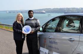 Anna Malloy, Stakeholder Engagement and Communications Manager with Father Paul Osunyikanmi, Apostleship of the Sea Chaplain for the Port of Milford Haven and Pembroke Port.