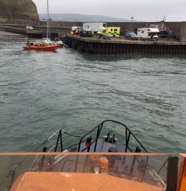 A 28ft yacht on passage from Oban in Scotland to Belfast got into difficulty when its five-person crew became ill in challenging sea conditions