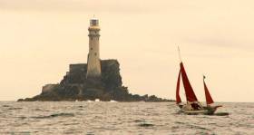 Jack O’Keeffe leads a race of Drascombes around the Fastnet Rock