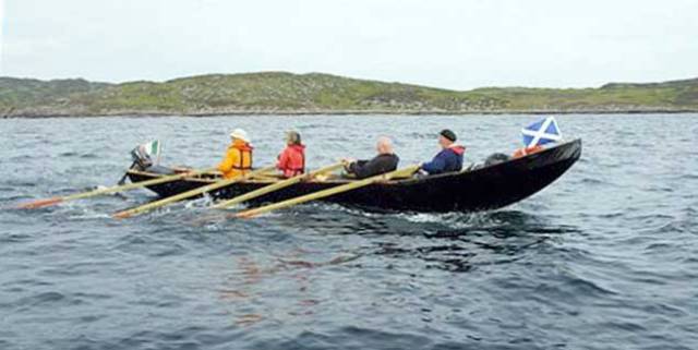 Voyage with a purpose – Danny Sheehy’s currach making purposeful progress through the Hebrides during the first of his pilgrimage voyages, delivering an Irish Bible from Kerry to the Abbey founded by St Columba at Iona in Scotland