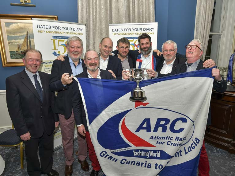Barry O’Sullivan and team, Paul Barrington, Alan Daly, Paul Fagan, Ted Murphy, Dave O’Reilly and Brian Uniacke, receive The Township Cup (1927). Barry and his teammates were awarded the township cup for their participation in the racing class of the Atlantic Rally Cruise (ARC) in November 2019 onboard their chartered Swan 80 “Umiko”. Scroll down for prizegiving photos