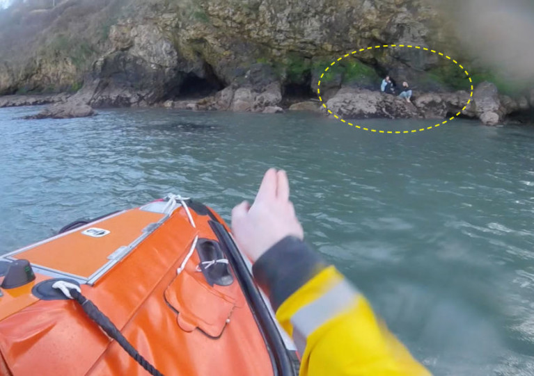 Howth RNLI’s inshore lifeboat approaches the stranded duo (circled) at the base of cliffs in Balscadden Bay