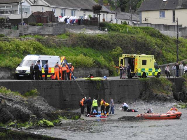 The injured cyclist is winched from the Strand at Wicklow Harbour to a waiting ambulance