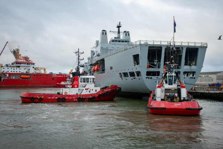 The UK's Royal Fleet Auxiliary replenishment supplies and fuel tanker RFA Fort Victoria following a 30 year Special Survey dry-docking at Cammell Laird shipyard in Birkenhead on Merseyside. AFLOAT also adds pictured in the facilities non-tidal wet basin is the newbuild scientific research vessel RRS Sir David Attenborough. 