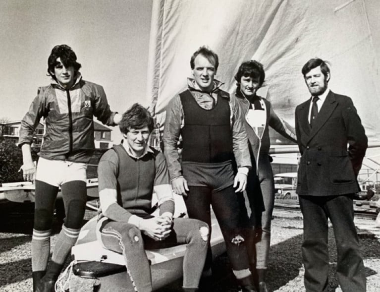 "Warriors About to Go into Battle". This properly serious-looking foursome from the cream of the 1982 Irish Laser Class, with their mentor Ron Huthcieson on right, are (left to right) Simon Brien (later multiple Edinburgh Cup winner and other majors), multiple champion Charlie Taylor (still at it in the Laser Masters), Olympian Bill O'Hara, and Dave Cummins, All-Ireland Helmsmans Champion 1981 and 1982