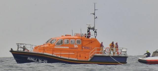 Baltimore RNLI’s all-weather lifeboat crew tows a RIB with two on board to safety