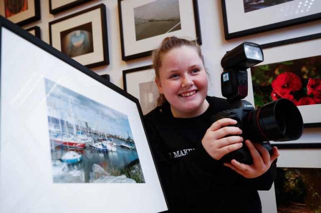 Niamh Carroll (age 12) from Ringsend College with her image of yachts and boats at Poolbeg Yacht and Boat Club marina from the exhibition