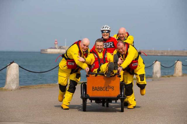 Volunteer crewmember and comedian PJ Gallagher joined members of Dun Laoghaire RNLI, where he volunteers, to help well-known fundraiser, Mary Nolan Hickey on her way as she cycles around Ireland for Mayday, Pictured with Mary and PJ are Kieran O’Connell (Colley), Coxswain Mark McGibney and Eamon O’Leary of Dun Laoghaire RNLI